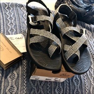 Chaco black & white (Verdant) adventure sandals.